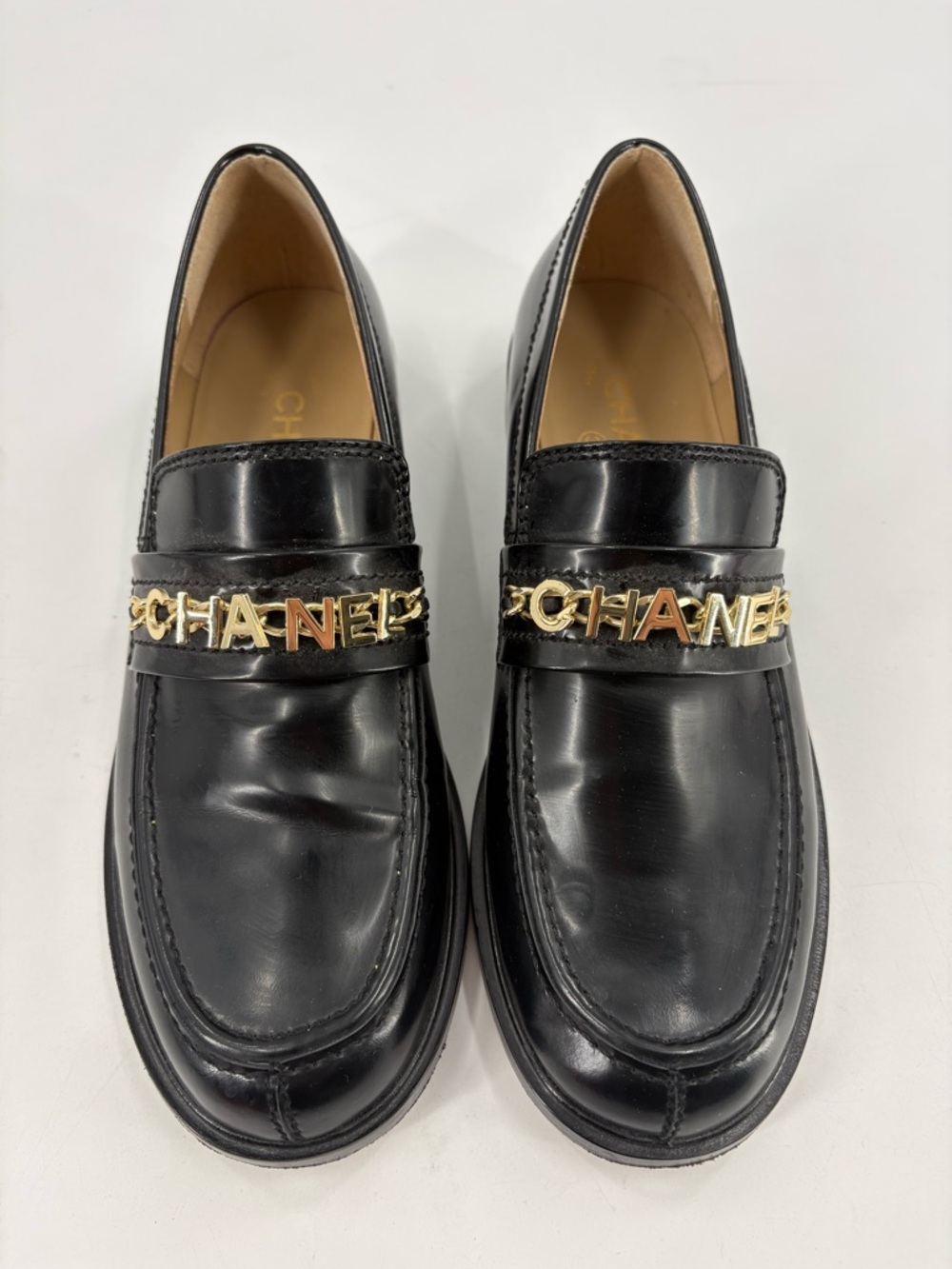 CHANEL Black Leather Loafers with Gold Logo Chain